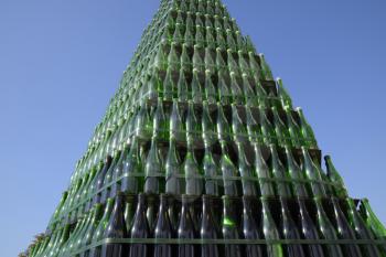 Christmas tree of bottles of champagne. Creative from bottles. Empty bottles of champagne.