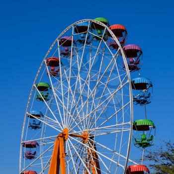 Ferris wheel. Ferris wheel in the city park. Seats for passengers on the ferris wheel.