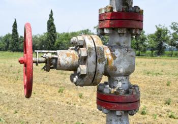 Manual shut-off valve on oil well. Oil well wellhead equipment