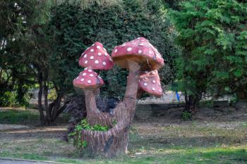 Sculpture mushrooms amanita. Toy mushrooms in the park. Scenery of mushrooms