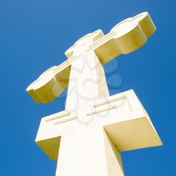White orthodox christian cross on blue sky background