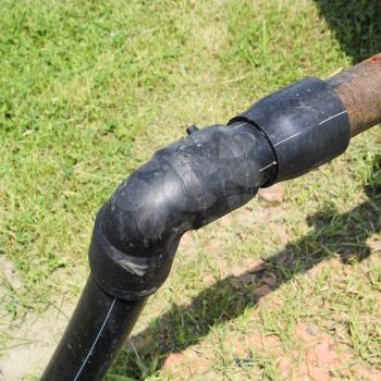 The pipe from the water tower. Steel or plastic pipe, valve and knee on the tube.