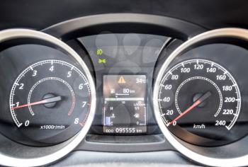 Modern car dashboard with moving arrows. The instrument panel of the car is out of motion.