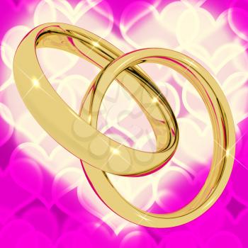 Gold Rings On Pink Heart Bokeh Background Represents Love Valentine And Romance
