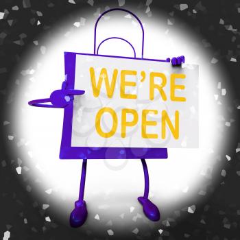We're Open Sign on Shopping Bag Showing New Store Launch Or Opening