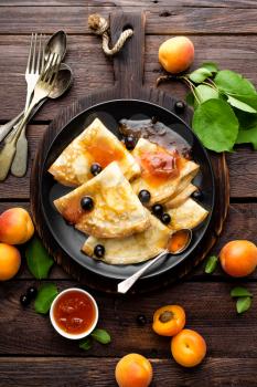 Pancakes with fresh blackcurrant and apricot jam