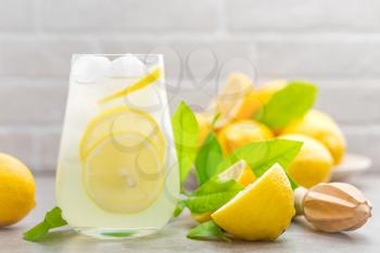 lemonade; lemon; drink; glass; juice; summer; fresh; background; fruit; cocktail; citrus; ice; water; cold; beverage; food; healthy; yellow; frozen; natural; white; sweet; refreshment; refreshing; str