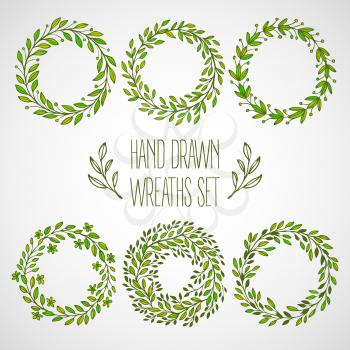Set of hands drawn decorative wreaths. Vector illustration EPS10