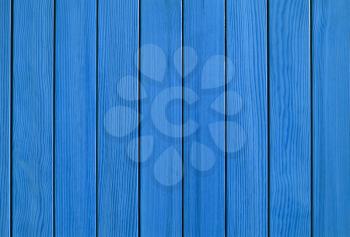 Blue wood background. Vertical fence