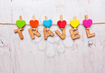the word travel of the wooden letters on a white background