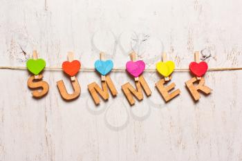 word summer of colorful wooden letters on a white background old