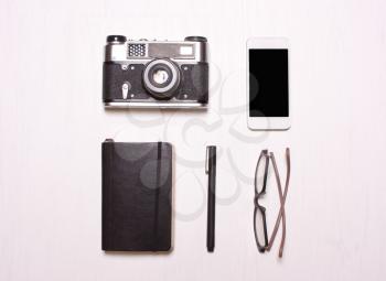  collaget,set hipster  accessorieson.rings, glasses, camera, phone, notebook a white background.Concept fashion person, hipster, photographer
