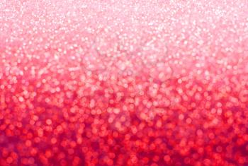 REd, pink glitter.Red sparkle. Glitter background. Holiday blurred background.