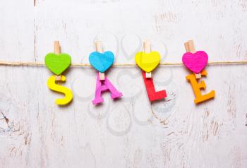 the word sale of colored letters on a white background
