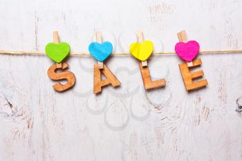 the word sale of wooden letters on a white background