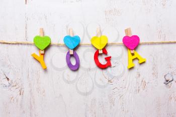 the word yoga of the colored letters on a white background
