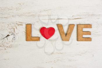 word love in wooden letters on a white background old wooden