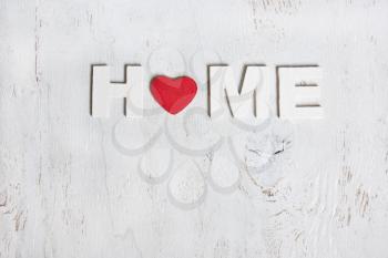 the word home made of wooden white letters on a white background old wooden