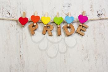 word pride attached rainbow hearts,symbol LGBT