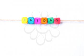 Friday word of multicolored cubes on a white background