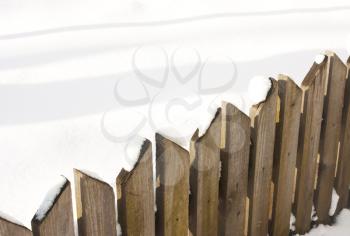 wooden fence close-up with snow