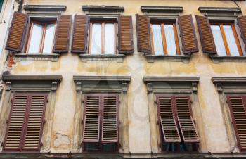 Old house with brown shutters in Florence, Italy (Firenze)