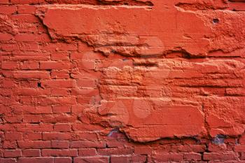 A wall of red brick, and a destroyed cement. Background from plaster of old, stone
