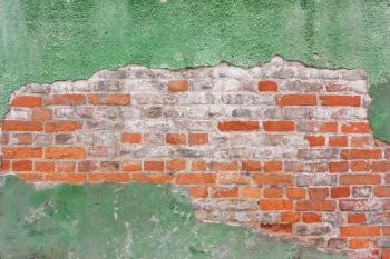 Background of  orange brick wall, masonry in a row and old, green, cracked plaster, cement