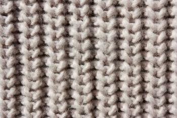  Rustic beige knitted wool background.