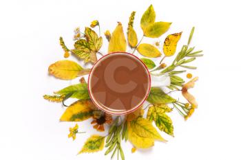 cup of coffee,cocoa in yellow leaves on a wooden background. View from above, flat. Concept of Autumn