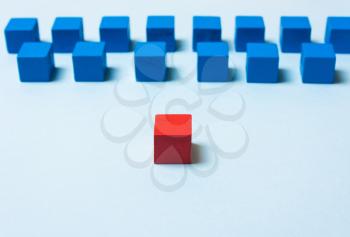 Blue and red cubes. Leadership concept. Soft focus
