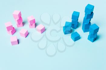Blue and pink cubes. The concept of sexism, feminism and equality. Soft focus