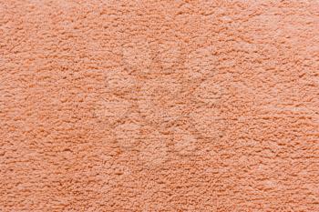 Beige soft fleece texture. The surface of a teddy microfiber rug