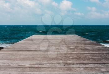 Wooden old bridge, pier, pier in the sea, ocean.Summer background with copy space