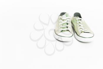 Vintage old green sneakers, shoes. Concept of multiple trips, free life, tourism