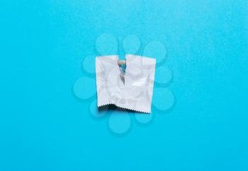 Condom on a blue background. concept stop infection with sexually transmitted diseases, STD,AIDS, HIV