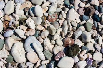 Marine naturally rounded gravel, pebbles. Nature Background Texture