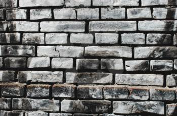 Grunge, gray dark, rough background. Brick wall on the street. Copy space