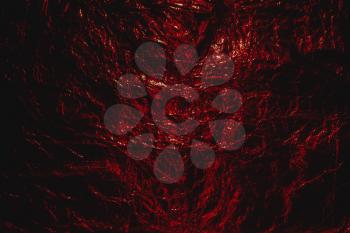 Red grunge abstract crumpled aluminum, titanium shiny foil  Halloween background