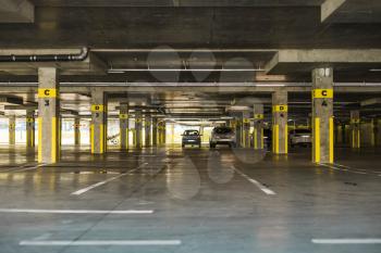 Underground car parking on which cars stand. Modern garage
