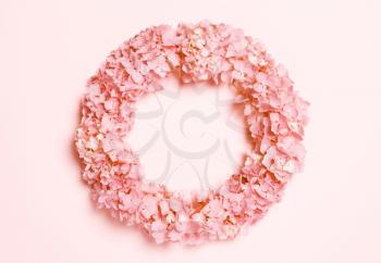 wedding, summer pastel background. The frame is round with white flowers on a coral, pink background. Copy of space