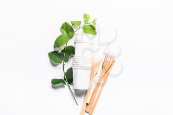 Paper cups, wooden fork, spoon, knife, tube, on white background. The concept of recycling, ecology, planet conservation, zero waste