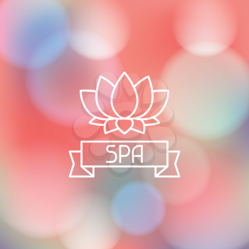 Spa wellness label on abstract blurred background.