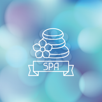 Spa wellness label on abstract blurred background.