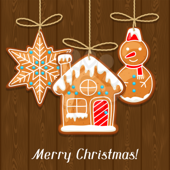 Merry Christmas greeting card with hanging gingerbread.