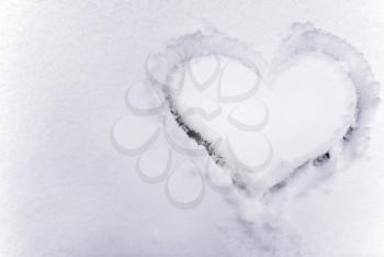 Heart on the snow. Element of design.