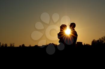 Couple in the sunset. Romantic scene.