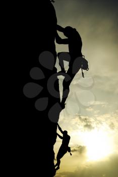 Silhouette of climber at the sunset. Element of deisgn.