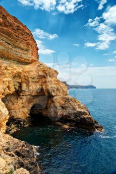 Cave in rock at the sea. Nature composition. 