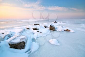 Stone on ice. Winter landscape.